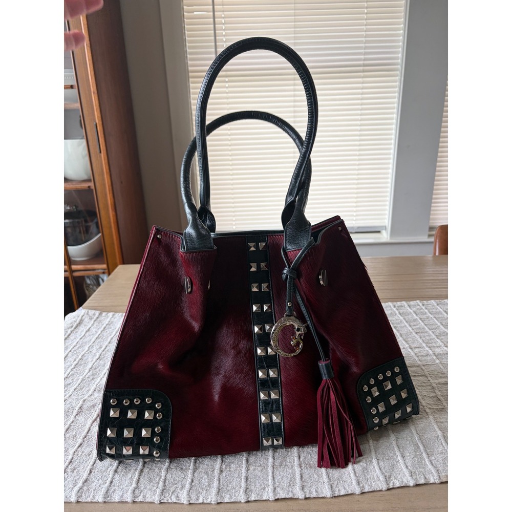 Sharif Originals shoulder bag burgundy haircalf body black accents pyramid studs